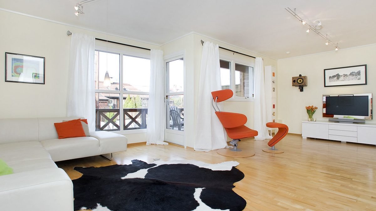 Bright modern apartment living room where an ESA letter removes pet rent