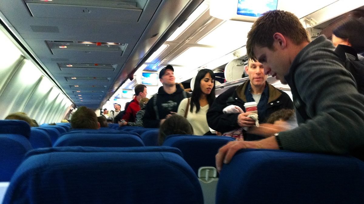 Passengers seated in an airplane cabin, flying with an ESA