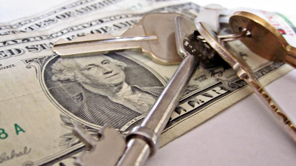 Keys and cash on a table, how landlords verify ESA letters